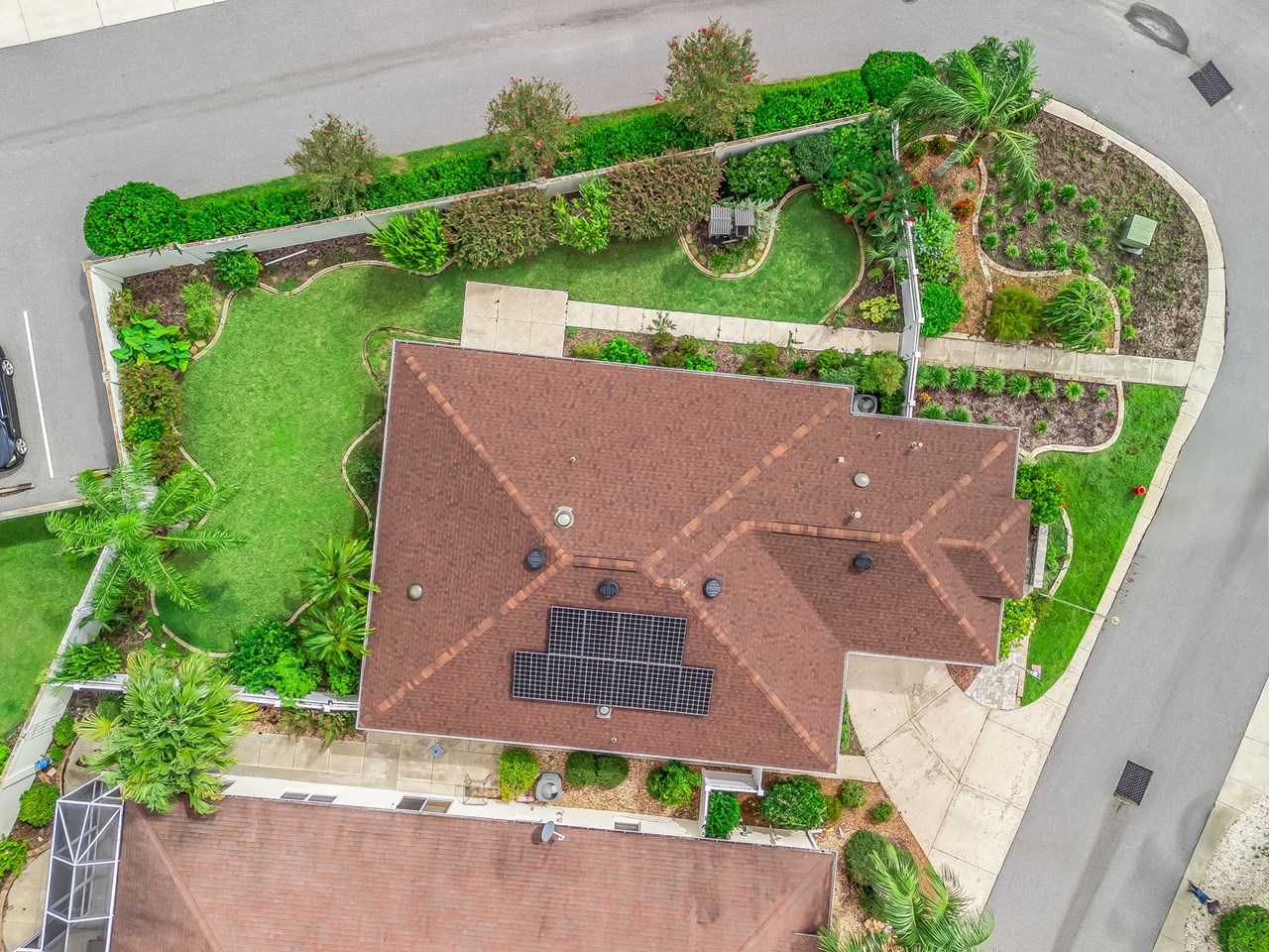 overhead view birds eye view of the huge courtyard and the 2021 roof with solar panels