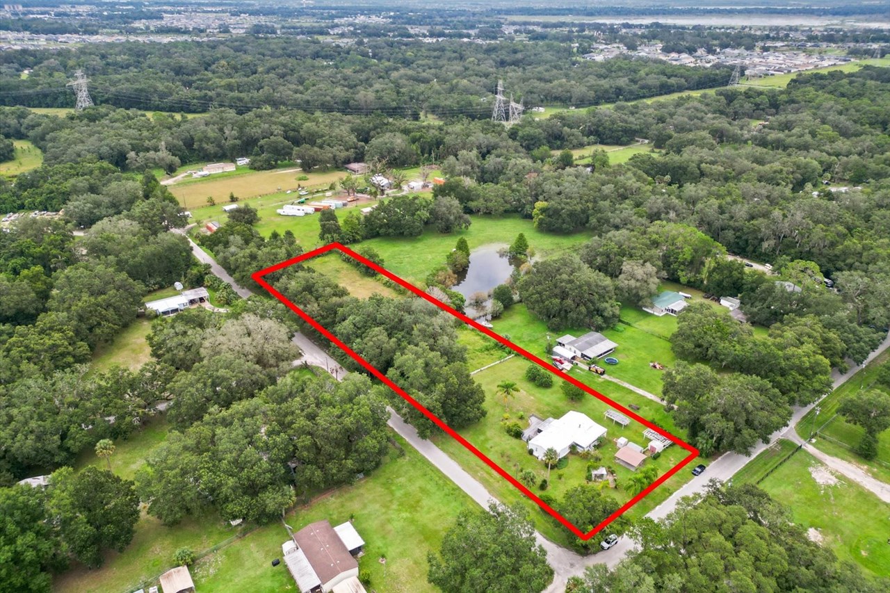 2.4 acres this corner lot has the advantage of road access from both the front and the side, making accessing the back acre a breeze.